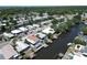 Wide aerial view of homes along canals in a verdant community at 5812 Liverpool Dr, Tampa, FL 33615