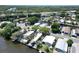 Expansive aerial view showcasing waterfront homes nestled along winding canals and waterways at 5812 Liverpool Dr, Tampa, FL 33615