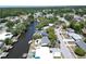 Scenic aerial view of canal-front homes in a lush, green neighborhood at 5812 Liverpool Dr, Tampa, FL 33615