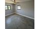 Bedroom with ample natural light, ceiling fan, and neutral color palette at 5812 Liverpool Dr, Tampa, FL 33615
