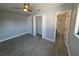 Bedroom showcasing tile floors, closet, and en-suite bathroom, filled with natural light at 5812 Liverpool Dr, Tampa, FL 33615