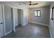 Spacious bedroom with a ceiling fan, closet, and two windows for lots of natural light at 5812 Liverpool Dr, Tampa, FL 33615