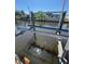 Close up shot of metal boat lift over a canal with sun reflecting on the water at 5812 Liverpool Dr, Tampa, FL 33615