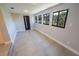 Sun-drenched bonus room featuring multiple windows and neutral finishes at 5812 Liverpool Dr, Tampa, FL 33615