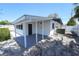 Additional structure featuring a carport, a white exterior, and a gravel driveway at 5812 Liverpool Dr, Tampa, FL 33615