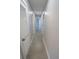 Hallway with multiple doors that provides access to various rooms in the home at 5812 Liverpool Dr, Tampa, FL 33615