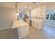 Bright kitchen with stainless steel appliances, white cabinetry, and sleek quartz countertops at 5812 Liverpool Dr, Tampa, FL 33615