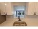 A stylish kitchen sink features a modern faucet and is complemented by the white countertop at 5812 Liverpool Dr, Tampa, FL 33615