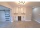 Kitchen featuring white cabinets, quartz countertops, and a built-in wine cooler for entertaining at 5812 Liverpool Dr, Tampa, FL 33615