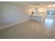Bright open kitchen featuring white cabinets, modern appliances, and an eat-in bar at 5812 Liverpool Dr, Tampa, FL 33615
