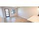 Bright living room featuring a ceiling fan, modern door, and a window with natural light at 5812 Liverpool Dr, Tampa, FL 33615