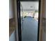 Exterior view from inside the home, showcasing the driveway and covered carport at 5812 Liverpool Dr, Tampa, FL 33615