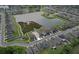 Aerial view of a home surrounded by a lake and lush landscaping in a residential community at 582 Royal Empress Dr, Ruskin, FL 33570
