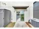 Home exterior featuring a sliding glass door with kitchen view, storage shed and AC unit in backyard at 582 Royal Empress Dr, Ruskin, FL 33570