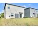 The home's backyard features green grass, landscaping and an outdoor storage shed at 582 Royal Empress Dr, Ruskin, FL 33570