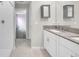 Bathroom features a double vanity with granite countertop, white cabinetry, and tile flooring at 582 Royal Empress Dr, Ruskin, FL 33570