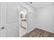 Hallway provides access to a bathroom and a closet with a wire shelf at 582 Royal Empress Dr, Ruskin, FL 33570
