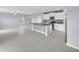 Open kitchen with white cabinetry, granite countertops, stainless appliances, and an expansive kitchen island at 582 Royal Empress Dr, Ruskin, FL 33570