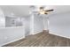 Spacious loft area with sleek wood flooring, neutral gray walls, and a ceiling fan for added comfort at 582 Royal Empress Dr, Ruskin, FL 33570