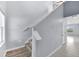 Elegant staircase with wood and white finishes, leading to the upper level of the home at 582 Royal Empress Dr, Ruskin, FL 33570