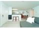 View of a living room which leads into a kitchen and dining area at 6006 Laketree Ln # K, Temple Terrace, FL 33617