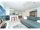 Open-concept living space with a sofa, breakfast bar, and dining area at 6006 Laketree Ln # K, Temple Terrace, FL 33617
