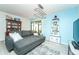 Cozy living room with a large gray sofa, decorative furnishings, and lots of natural light at 6006 Laketree Ln # K, Temple Terrace, FL 33617