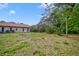 Wide open backyard showing home and pool area at 7333 Royal Oak Dr, Spring Hill, FL 34607