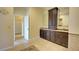 Bathroom with double vanity and tan tile floor at 7333 Royal Oak Dr, Spring Hill, FL 34607