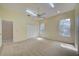 Bright bedroom with carpeting, ceiling fan, and closet with lots of hanging space at 7333 Royal Oak Dr, Spring Hill, FL 34607