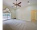 Bedroom features plush carpet, neutral colors, and large window with natural light at 7333 Royal Oak Dr, Spring Hill, FL 34607