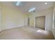 Bright bedroom with carpeting, ceiling fan, and closet with plenty of space for storage at 7333 Royal Oak Dr, Spring Hill, FL 34607