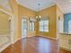 Inviting dining area with hardwood floors, large windows, and chandelier lighting at 7333 Royal Oak Dr, Spring Hill, FL 34607