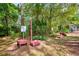 View of the community dog park featuring various obstacles and shaded areas for pets to play at 7333 Royal Oak Dr, Spring Hill, FL 34607