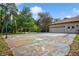 Paved driveway and basketball court leading to a garage at 7333 Royal Oak Dr, Spring Hill, FL 34607