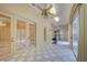 Bright exercise room featuring tiled floors, fan lighting, and sliding glass doors to the pool at 7333 Royal Oak Dr, Spring Hill, FL 34607