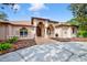 Beautiful home featuring a well-manicured yard, architectural design, and a welcoming brick-paved entrance at 7333 Royal Oak Dr, Spring Hill, FL 34607