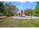 Single-story home featuring well-maintained landscaping and a circular driveway at 7333 Royal Oak Dr, Spring Hill, FL 34607