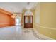 Foyer with large double doors, high ceilings, marble floors, and a stunning chandelier at 7333 Royal Oak Dr, Spring Hill, FL 34607