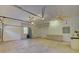 Spacious garage with ample storage, work area, and overhead lighting for projects and parking at 7333 Royal Oak Dr, Spring Hill, FL 34607