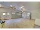Spacious two-car garage with ceiling fans and ample space for vehicles and storage at 7333 Royal Oak Dr, Spring Hill, FL 34607