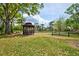 Charming community gazebo surrounded by lush greenery and mature trees in a serene setting at 7333 Royal Oak Dr, Spring Hill, FL 34607