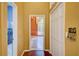 Hallway view featuring hardwood floors and a glimpse of a living room at 7333 Royal Oak Dr, Spring Hill, FL 34607