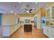 Spacious kitchen featuring custom white cabinetry, large island, and stainless steel appliances at 7333 Royal Oak Dr, Spring Hill, FL 34607