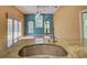 Kitchen with granite countertops, stainless steel sink, and bright natural light at 7333 Royal Oak Dr, Spring Hill, FL 34607