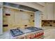 Gourmet kitchen features stainless steel range, custom cabinets, and granite countertops at 7333 Royal Oak Dr, Spring Hill, FL 34607