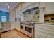 The kitchen includes stainless steel range and hood vent with stone backsplash at 7333 Royal Oak Dr, Spring Hill, FL 34607