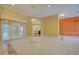 Spacious living area with marble floors, modern lighting, and easy access to other parts of the home at 7333 Royal Oak Dr, Spring Hill, FL 34607