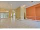 Spacious living room with marble floors, chandelier, and arched doorways creating an elegant atmosphere at 7333 Royal Oak Dr, Spring Hill, FL 34607
