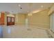 Bright living room features marble floors, elegant chandelier, and plenty of space for entertaining guests at 7333 Royal Oak Dr, Spring Hill, FL 34607